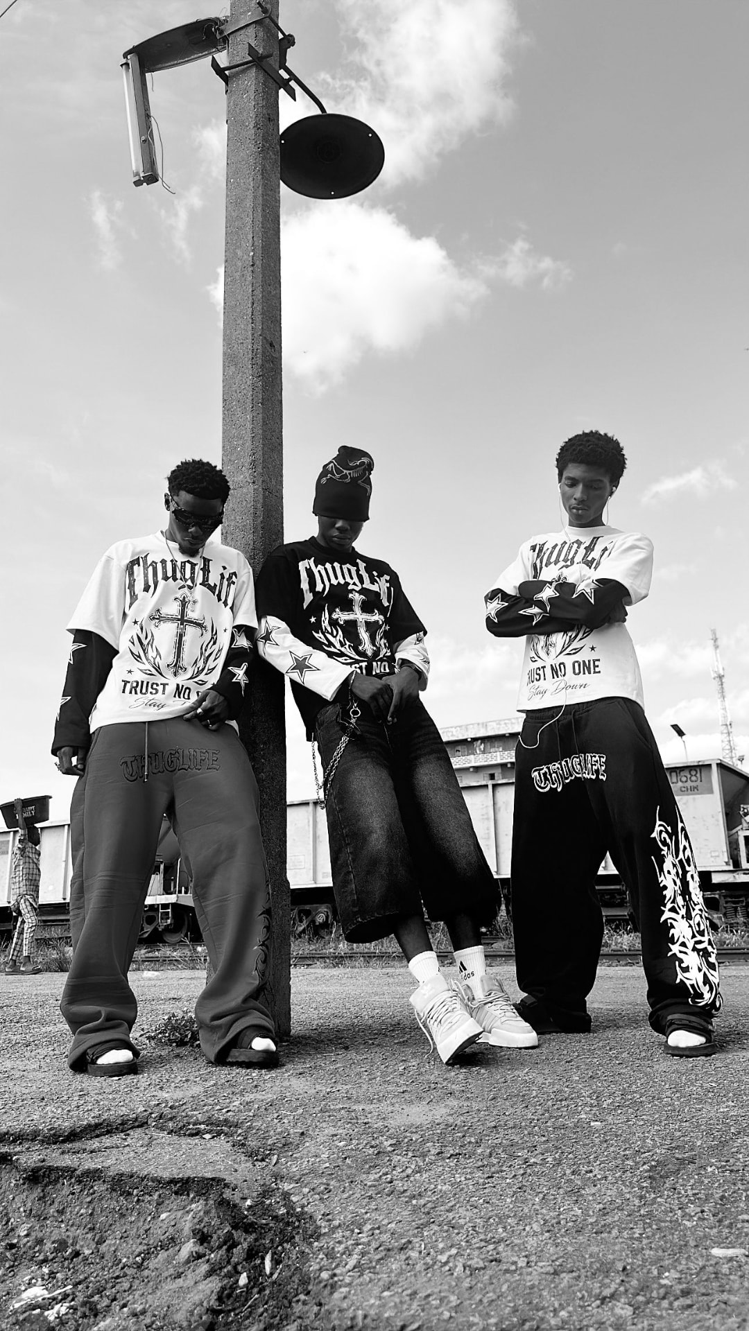 THUGLIFE crew in a Kwara rail yard wearing the Trust No One collection